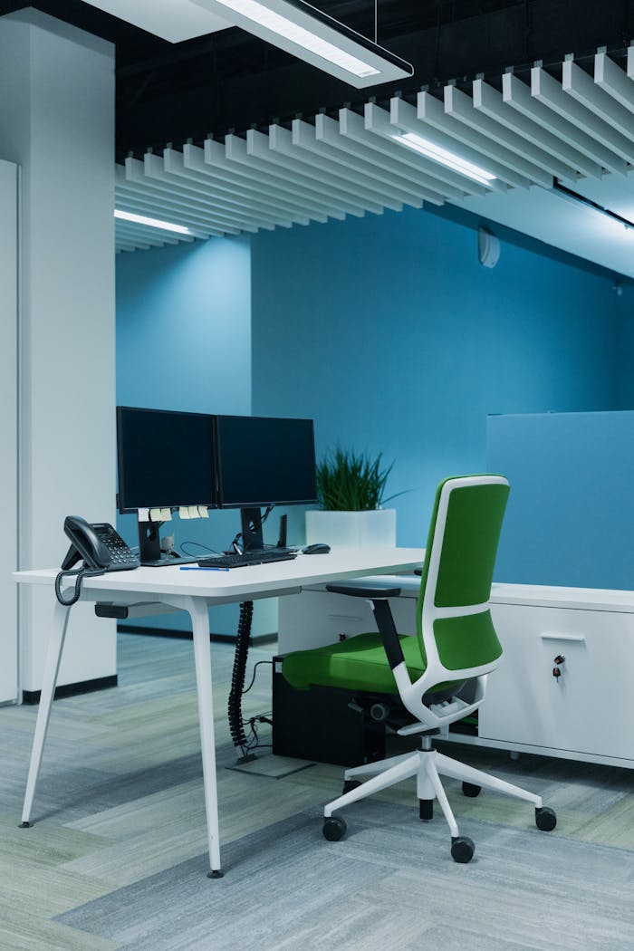 Contemporary office setup featuring dual monitors and ergonomic design for productivity.